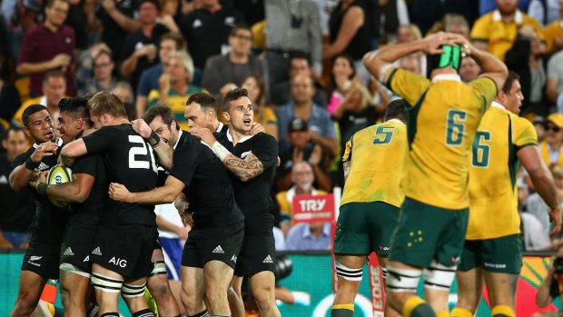 Sudden death: Wallabies players face their crushing loss to the All Blacks.