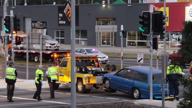 A car involved in a chase from Logan to Redland Bay is towed on Sunday.