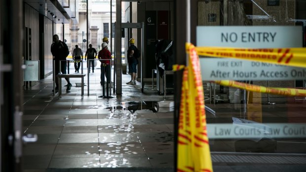 A faulty sprinkler caused water damage to at least four floors of the Law Courts building.