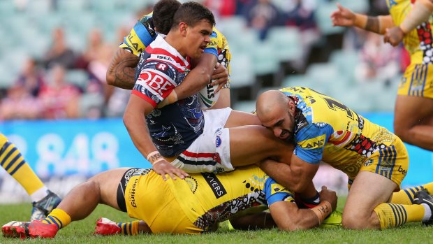 One for the future: Latrell Mitchell makes a nuisance of himself during an eye-catching display.