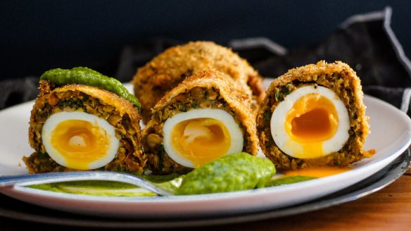 Vegetarian scotch eggs with vibrant green goddess dressing.