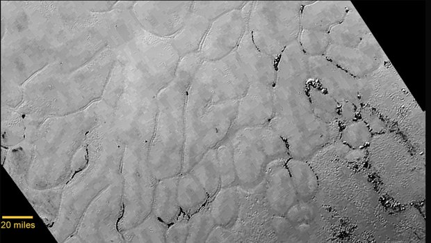 An image recorded by NASA's New Horizons spacecraft shows a  heart-shaped feature on the surface of Pluto that scientists have named the "Tombaugh Regio" after Pluto's discoverer Clyde Tombaugh.