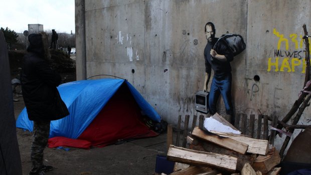 Street artist Banksy has highlighted the migrant crisis in a mural at a refugee camp in France. 