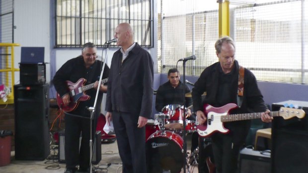 Former Midnight Oil musician Murray Cook (right) jamming with Peter Garrett on NAIDOC Day in Long Bay Jail.

