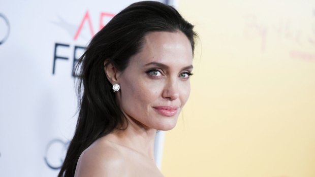 Single life is tough, but Angelina Jolie keeps a brave face in front of the children.