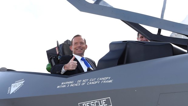 Then prime minister Tony Abbott in a replica F-35 jet in Canberra in 2014.
