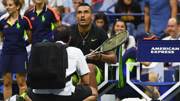 Timeout: Nick Kyrgios is examined during his third-round match.