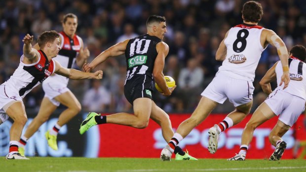 Now you see him: Scott Pendlebury is hemmed in by Saints. He spent 14 minutes on the bench in the third quarter. 