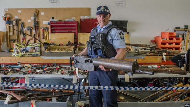 National Firearms Amnesty haul in the ACT. First constable Douglas Djurica with a WWI machine gun which will be donated to the Australian War Memorial. 