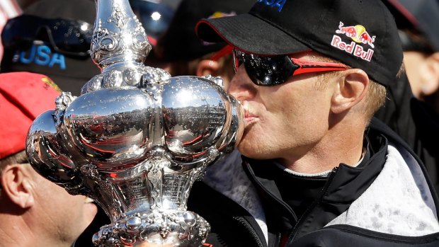 Triumph: James Spithill kisses the Auld Mug after winning the America's Cup with Oracle Team USA in San Francisco.