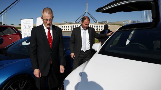 Urban Infrastructure Minsiter Paul Fletcher and Environment Minister Josh Frydenberg at an electric car event on the front lawn of Parliament House.
