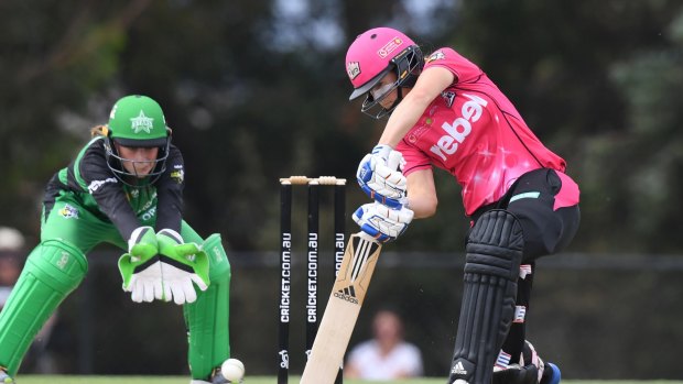 On the front foot: Ellyse Perry drives against the Melbourne Stars at Casey Fields, Cranbourne East in Melbourne.