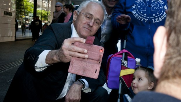 Prime Minister Malcolm Turnbull takes selfies in the Queen Street Mall. 