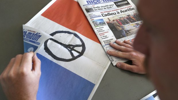 A French flag printed in the Nice Matin newspaper on Friday for the national day of mourning.