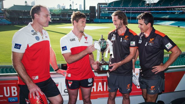 Battle for Sydney: Swans coach John Longmire and vice-captain Luke Parker alongside GWS coach Leon Cameron and co-captain Callan Ward at the SCG.