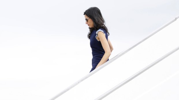 Huma Abedin walking off of Clinton's campaign plane in September.