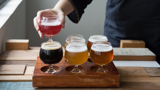 A tasting paddle of six Pasteur Street Brewing Company ales costs VND 250,000 ($A15)