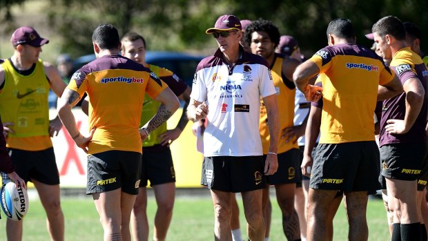 Broncos coach Wayne Bennett talks to his players at training earlier this month.