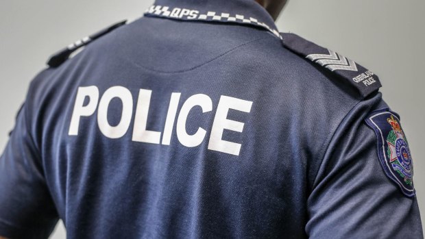 Police have charged a man after he allegedly attacked officers in Townsville.
