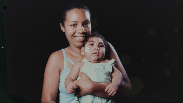 Tatiane do Nascimento holds her son Willamis Silva, who was born with microcephaly, as a result of his mother's Zika infection, in Recife, Brazil. 