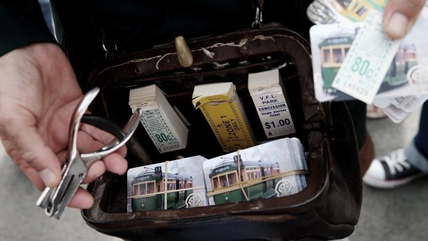 Former tram conductor Roberto D'Andrea carries original tram tickets from decades ago, as well as souvenir historical swap cards.