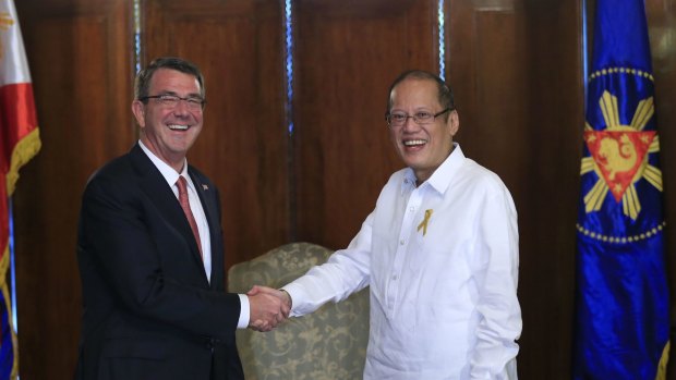 Philippine President Benigno Aquino (right) greets US Defence Secretary Ash Carter at the Malacanang presidential palace.