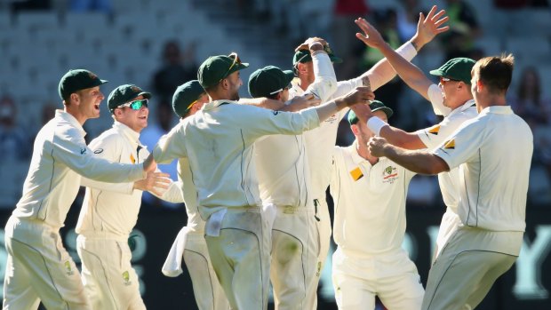 Victors: Australia celebrate the final wicket and winning the second Test against the West Indies.