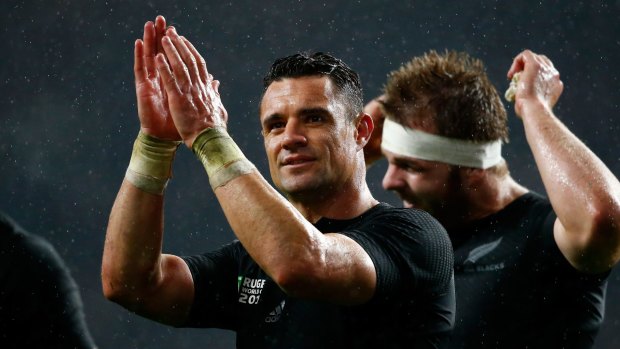 Give yourself a hand: Dan Carter celebrates the All Blacks win over South Africa.