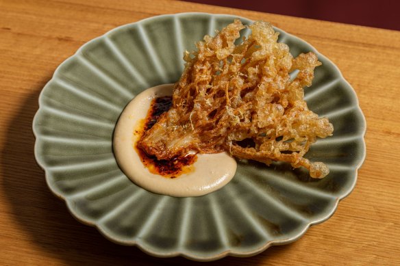 Tempura enoki mushroom with almond tarator and chilli oil.