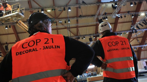 Work goes ahead in the hall that will welcome the COP21 climate summit north of Paris.