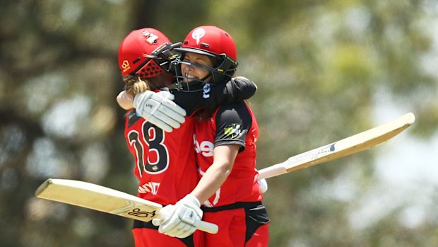 Molineux and Danni Wyatt celebrate victory.