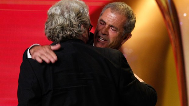 Mel Gibson congratulates George Miller on winning an AACTA Award.