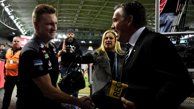 McGuire congratulates Buckley after the Pies beat West Coast in round  18. 