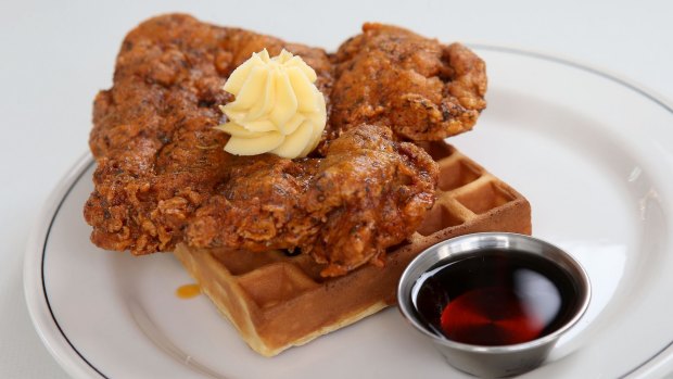 Fried chicken and waffle with whipped butter and bourbon-spiked maple syrup.