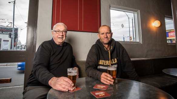 Ascot Vale Hotel regulars 'Rocket' Rod (left) and Danny Cash, who both have their names on the Coldest Pots Club board behind them.