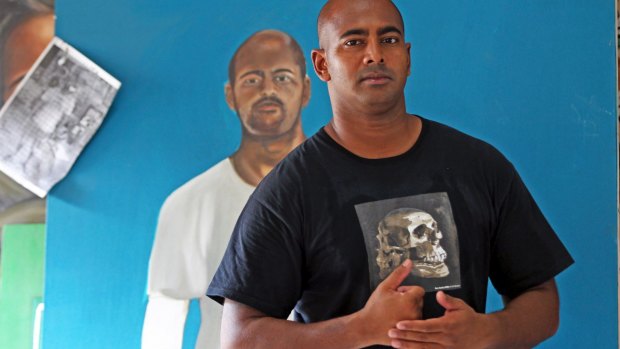 Myuran Sukumaran with a portrait of himself painted by another inmate at Kerobokan Prison.