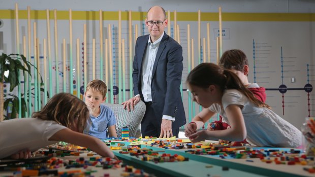 Nathan Jones, and his children, have found the school holiday program at his workplace, Insurance Australia Group, a boon.