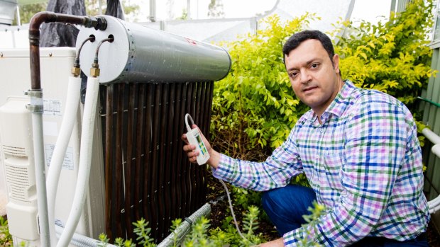 Engineer Vahid Vakiloroaya with the IP Kinetik system, which can cut energy use by air conditioners by 30 per cent.