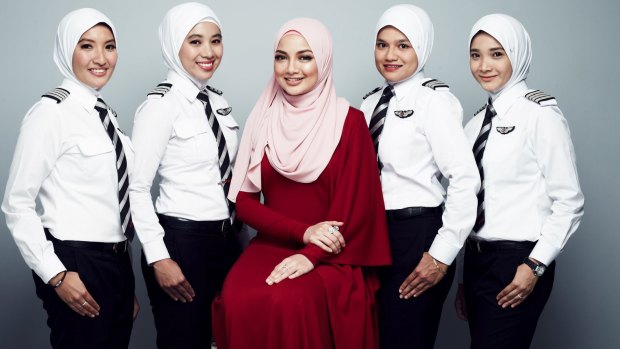 AirAsia pilots wearing the new hijab with designer Neelofa.