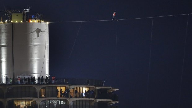 High stakes: Nik Wallenda's shadow is cast against Chicago's West Marina Tower.