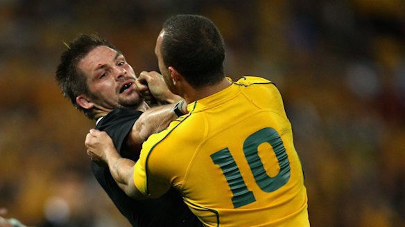Richie McCaw and Quade Cooper go at it in Brisbane in 2011.