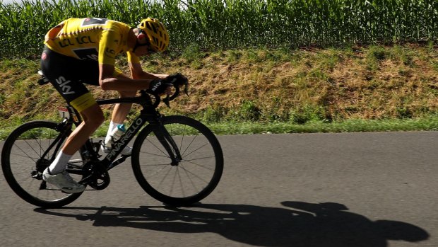 Under pressure: Chris Froome survived a tough day in the saddle.