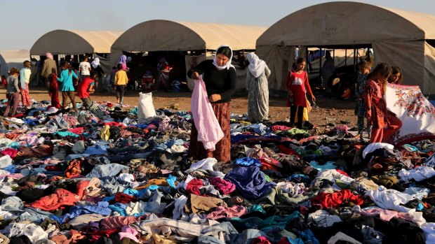 Displaced Iraqis from the Yazidi community at the Nowruz camp in  Syria in 2014. 