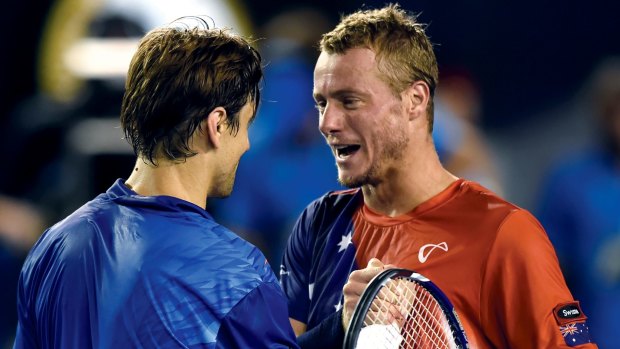 David Ferrer, left, is congratulated by Lleyton Hewitt after the match.