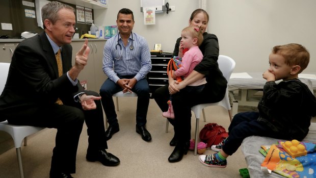 Opposition Leader Bill Shorten meets with Chontelle Sands and her two-year-old daughter Amelia Sands who is visiting the doctor because of a cough, and accompanied by her brother three-year-old Mason Sands during a visit to the Gosnells Healthcare Centre in WA.