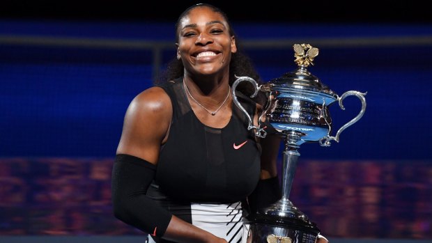 Serena Williams with the Australian Open trophy on Saturday night.