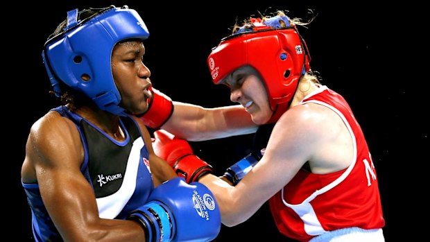 Nicola Adams (L) trades blows with Walsh.