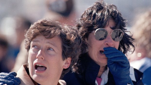 Spectators at the Kennedy Space Centre react after they witnessed the explosion of the space shuttle Challenger.