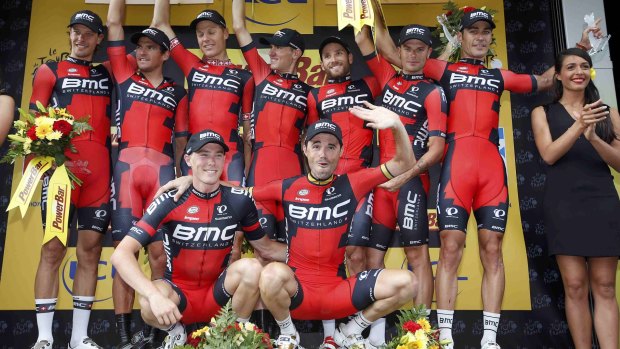 BMC Racing riders celebrate on the podium.