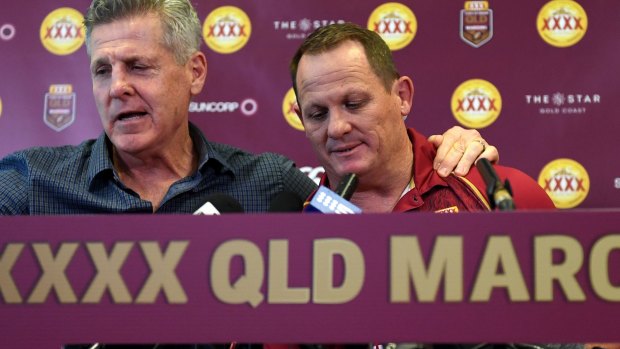 Queensland coach Kevin Walters (right) is comforted by chief selector Gene Miles.